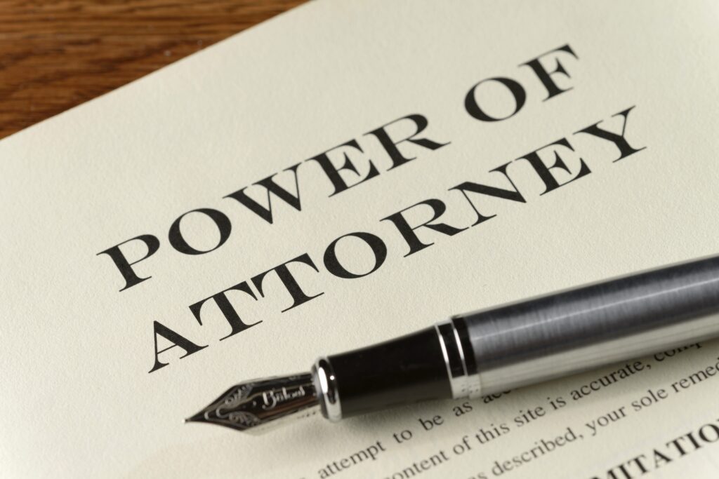 Power,Of,Attorney,Document,With,Silver,Fountain,Pen Power of attorney written on a document